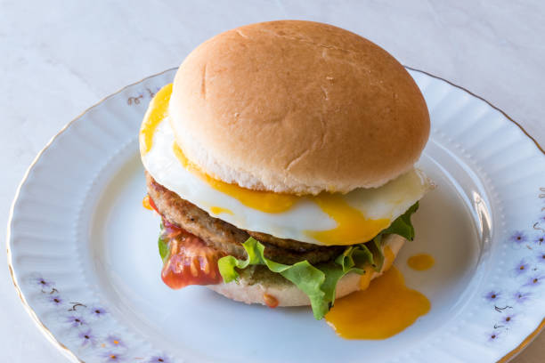 istock Homemade Double Hamburger with Egg, Lettuce and Tomatoes. 932424106