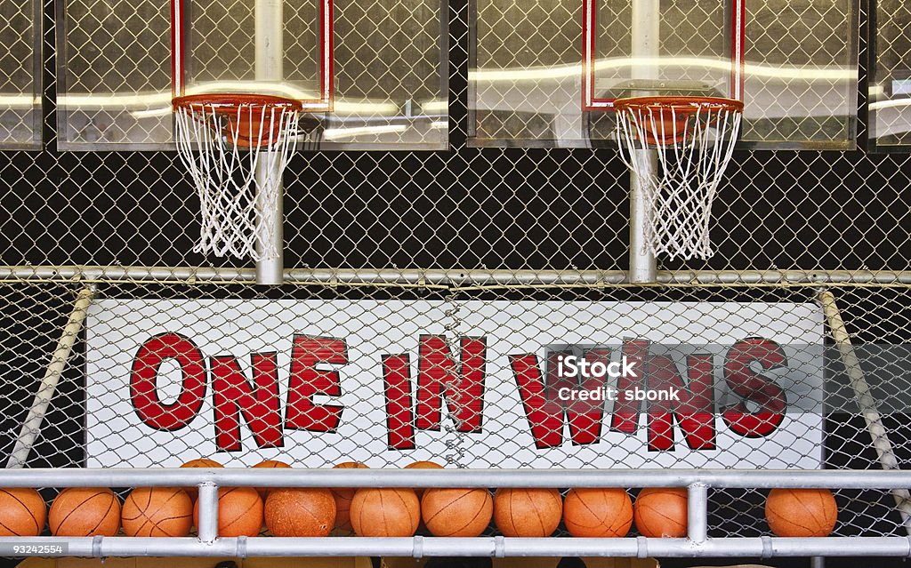 One in Wins A basketball game of chance on a boardwalk Amusement Arcade Stock Photo