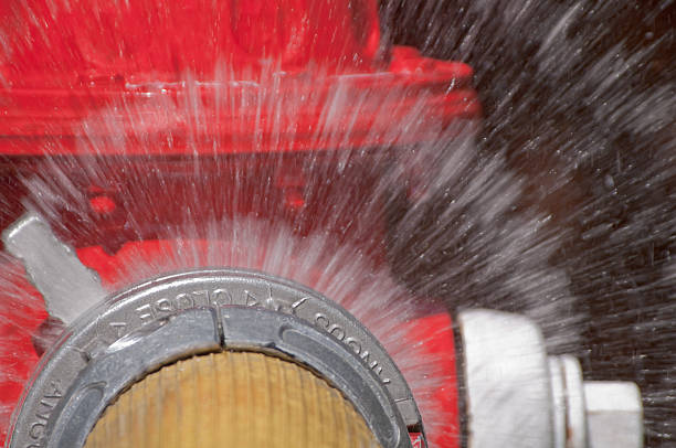 Fire hydrant with water spray close up stock photo