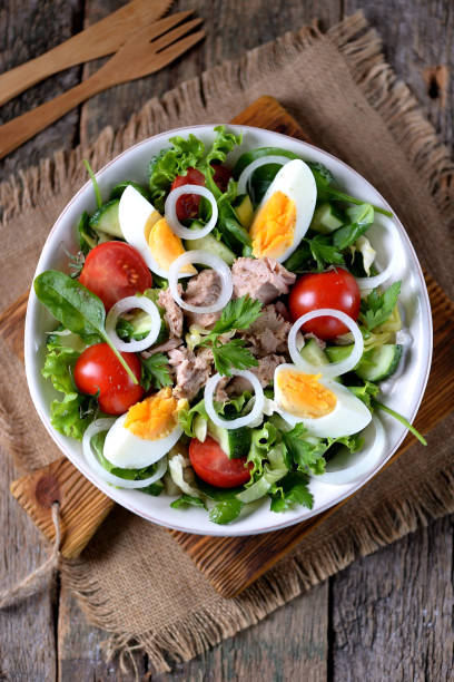 istock Salad from canned tuna with lettuce, cherry tomatoes, cucumber 932433058