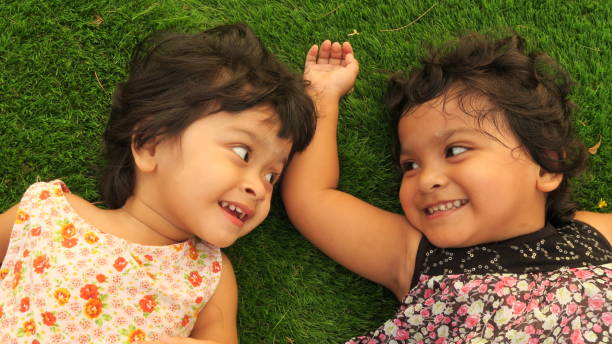istock Smiling little cute girls 932433424