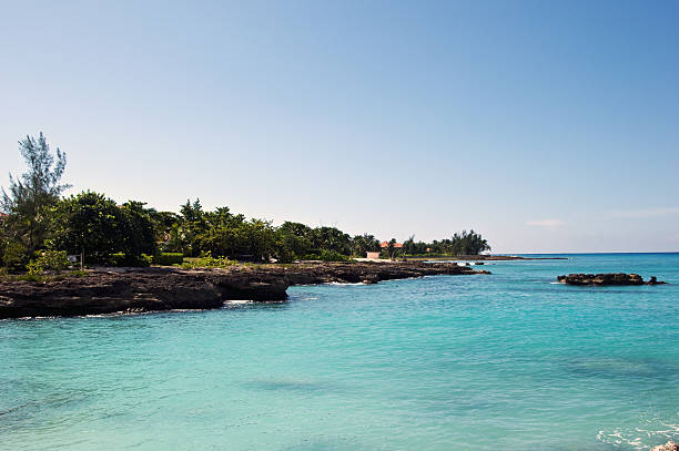 istock Blue sea and coral rocks with sky background 93243448