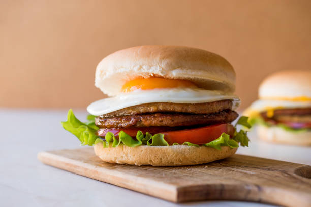 istock Homemade Double Hamburger with Egg, Lettuce and Tomatoes. 932437114