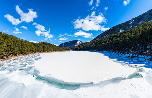 Engolasters Lake frozen in winter. Andorra