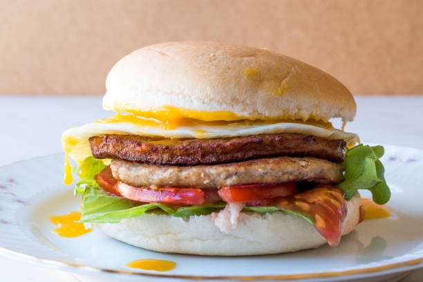 istock Homemade Double Hamburger with Egg, Lettuce and Tomatoes. 932439658