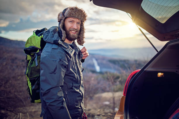 istock Hiking couple is looking the map 932440142