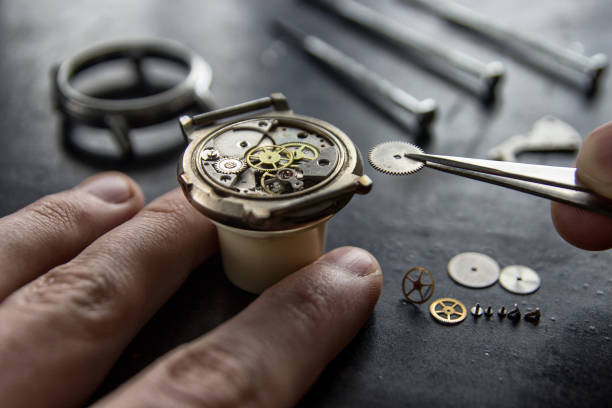 istock Watchmaker is repairing the mechanical watches in his workshop 932440756