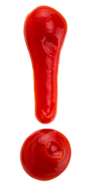 istock Exclamation point of red ketchup catsup sauce on white background 932440774