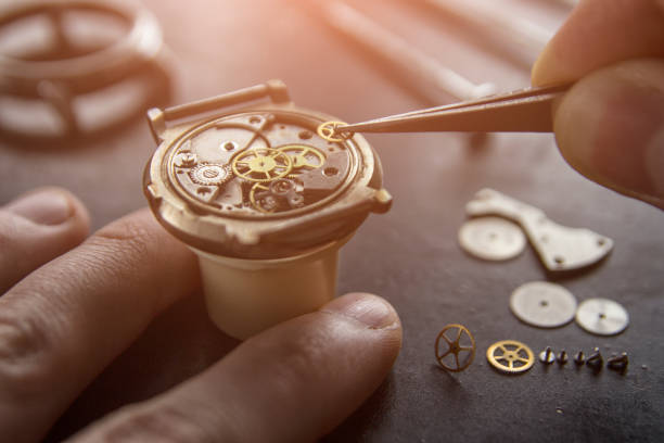 istock Watchmaker is repairing the mechanical watches in his workshop 932443132
