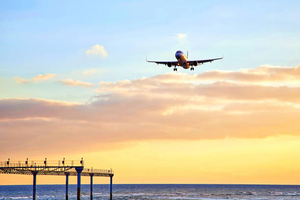 istock Beautiful Lanzarote island landscape with airplain at sunset 932455582