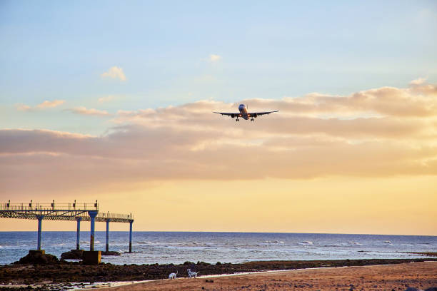 istock Beautiful Lanzarote island landscape with airplain at sunset 932455586