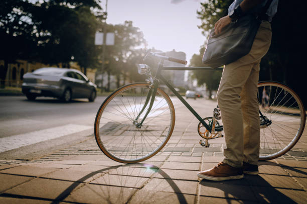 istock Crossing the Street with the bicycle 932458350