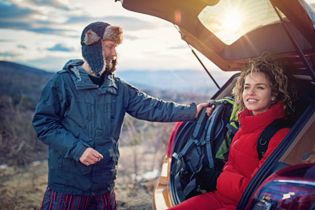 istock Hiking couple is resting after long trekking in mountain 932458368