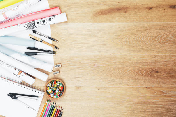 istock Wooden desk with supplies 932459200