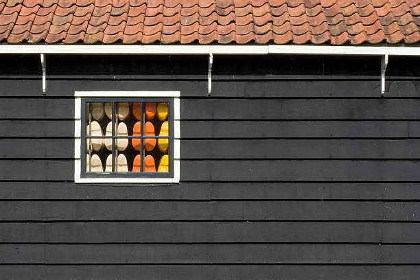 clogs behind window stock photo