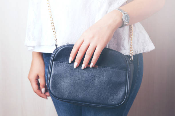istock young style woman hand handbag 932466766