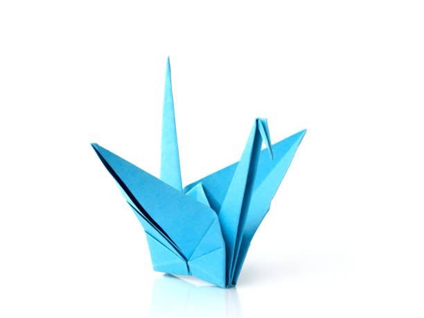 istock Blue origami crane isolated. 932466920