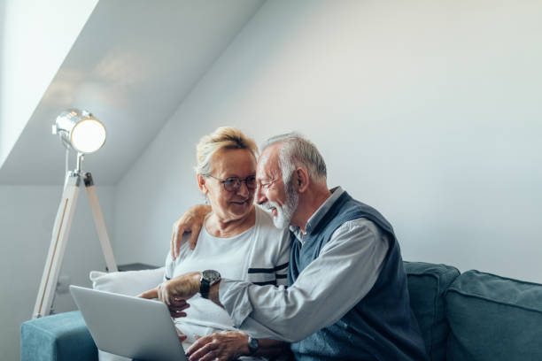 istock Looking at their daughter's wedding photos 932467278