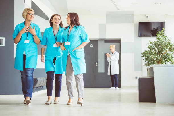 istock Nurses talking at the hospital corridor 932469392