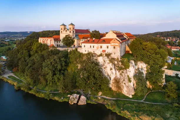 Benedictine monastery on the rocky hill in Tyniec near Cracow, Poland, and Vistula River. Aerial view at sunset