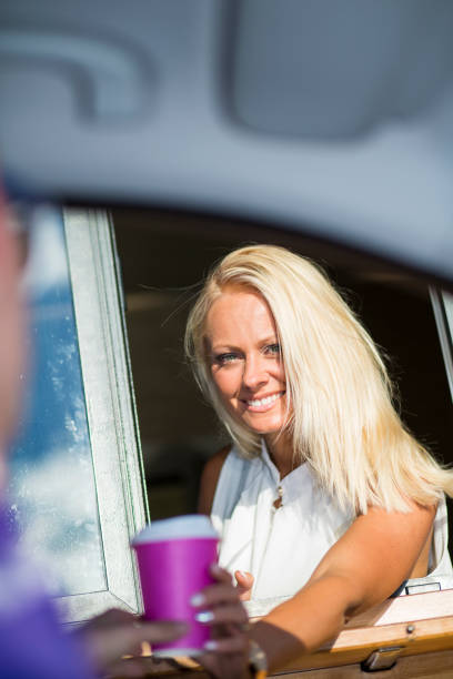 istock Drive-in caffe female clerk 932471220