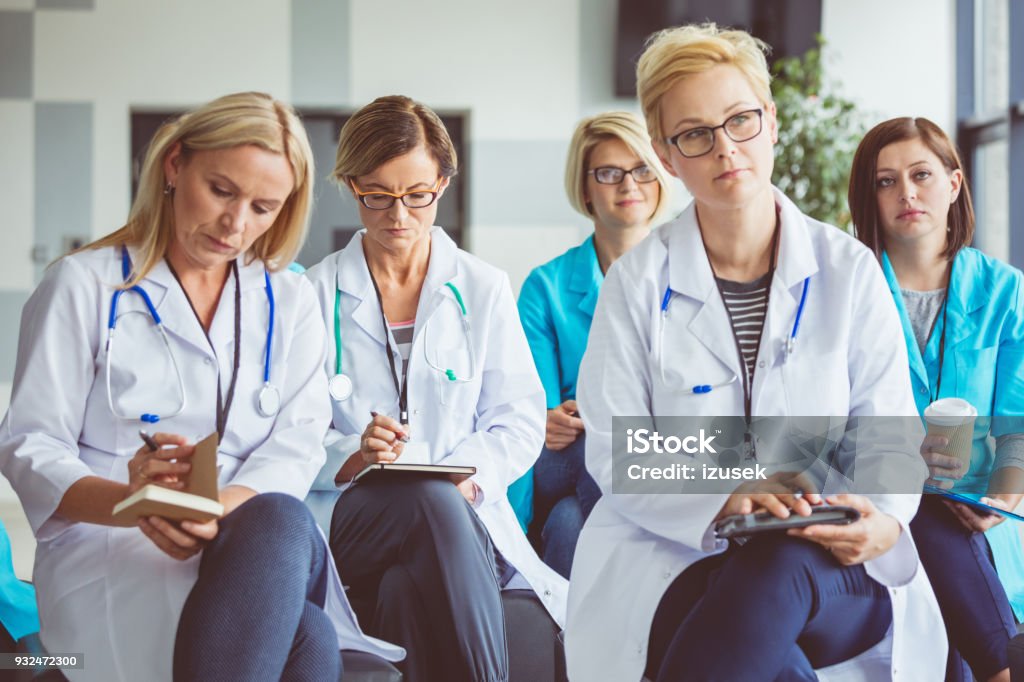 Seminar for medical personel Seminar for medical staff. Female doctors and nurses listening to presenter and taking notes. Conference - Event Stock Photo Seminar for medical personel Seminar for medical staff. Female doctors and nurses listening to presenter and taking notes. Conference - Event Stock Photo