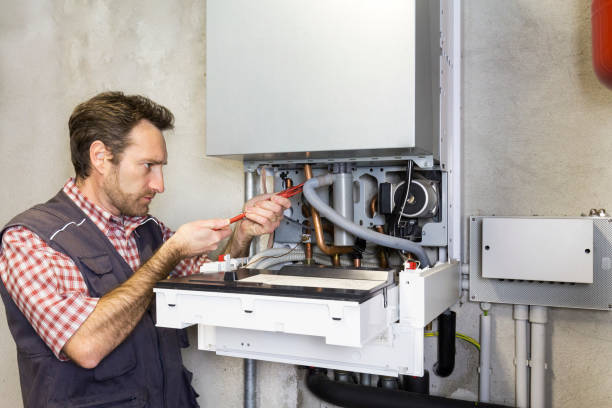 istock plumber repairing a condensing boiler 932472648