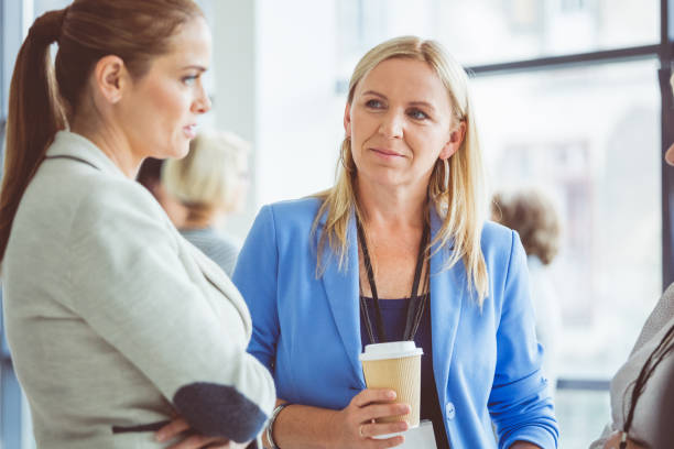 istock Seminar for woman, women discussing during coffee break 932477758