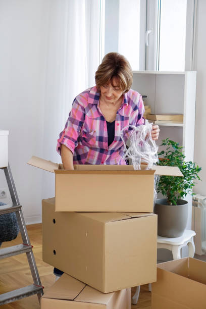 istock Senior woman moving into a new apartment 932478154