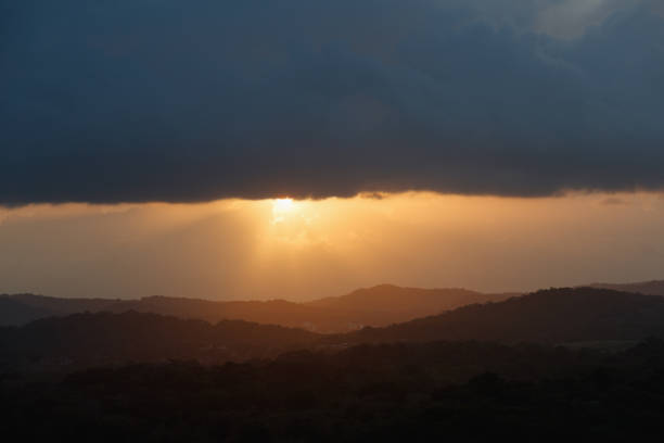 canal of panama with cloudy sky at sunset - panama canal panama mountain sunset imagens e fotografias de stock