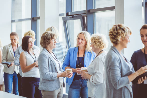 istock Seminar for woman, women discussing during coffee break 932482336