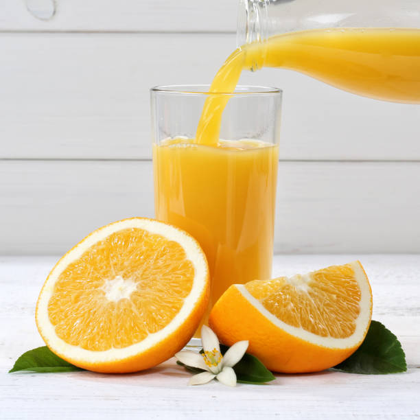 istock Orange juice pouring pour square oranges fruit fruits 932486504