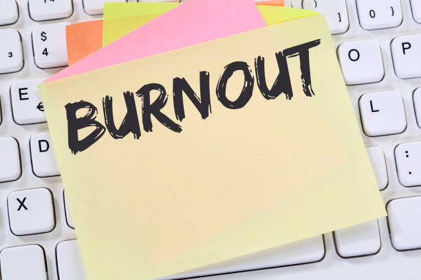 istock Burnout ill illness stress stressed at work business note paper 932488414