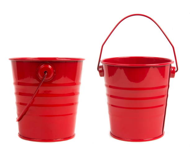 istock Close-Up Of Red Painted Buckets Over White Background 932495250