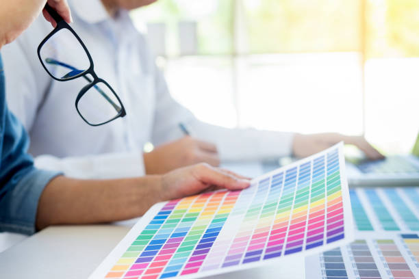 istock Colleagues Working On Color Swatch At Office 932503176