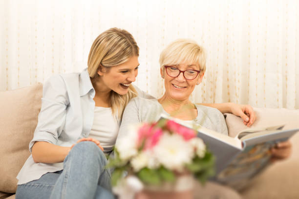 istock Mother and daughter remember the beautiful moments 932503310