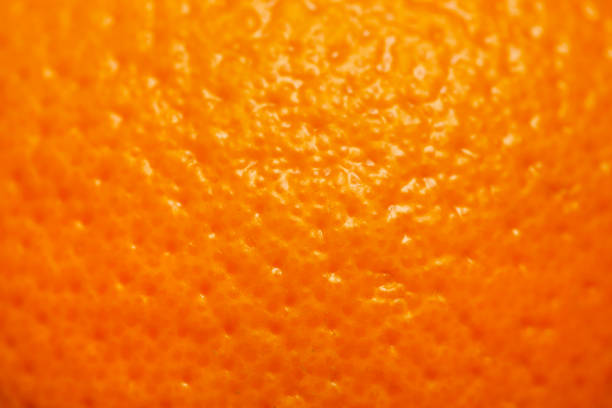 istock Close up image of orange skin texture 932504088
