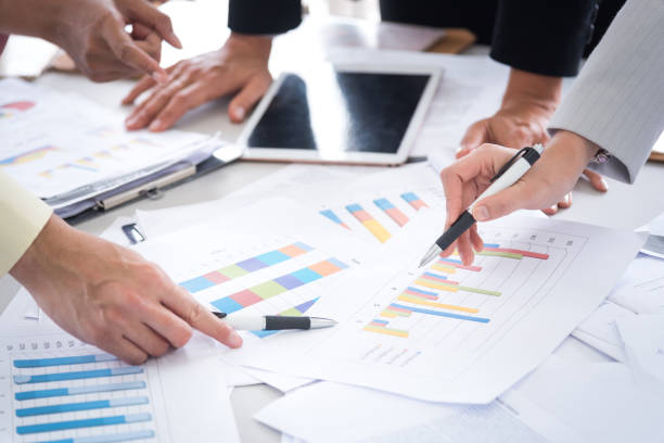 istock Midsection Of Business Colleagues Working In Office 932506210