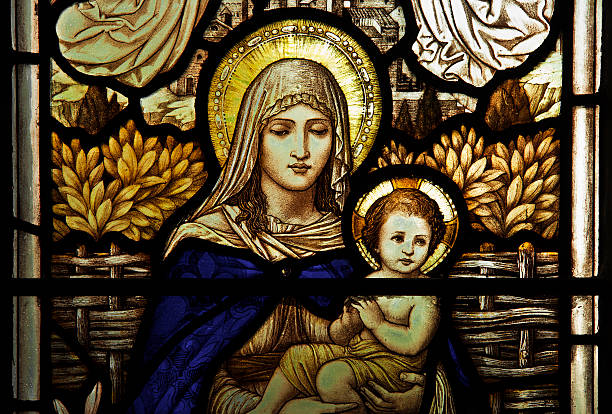 Mary and Jesus depicted in stained glass Stained glass depiction of Mary and Jesus taken in Davenham church Cheshire virgin mary stock pictures, royalty-free photos & images