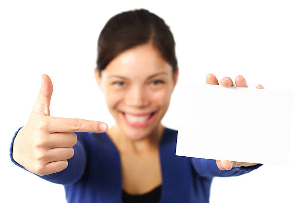 istock Woman pointing at business card 93251135