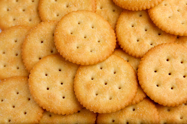 istock Pile of circular golden snack crackers 93251955