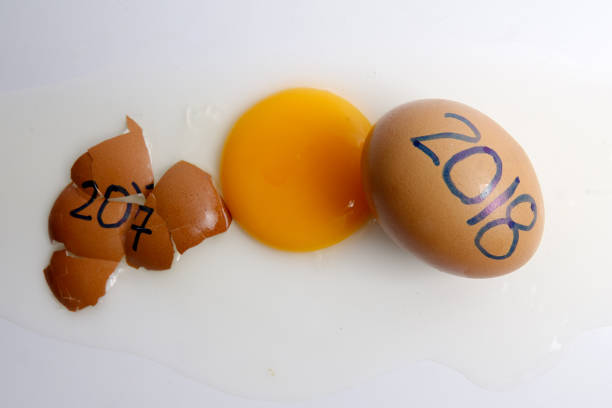 istock Close-Up Of Broken Egg With Numbers Over White Background 932526054