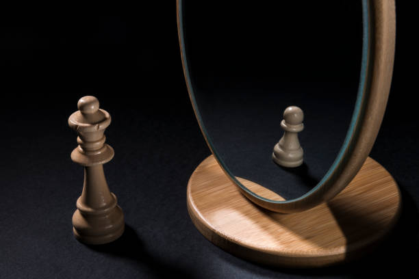istock The chess pieces in front of the mirror. 932541716
