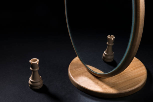 istock The chess pieces in front of the mirror. 932541754