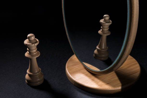 istock The chess pieces in front of the mirror. 932541826