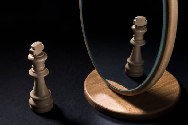 istock The chess pieces in front of the mirror. 932541894