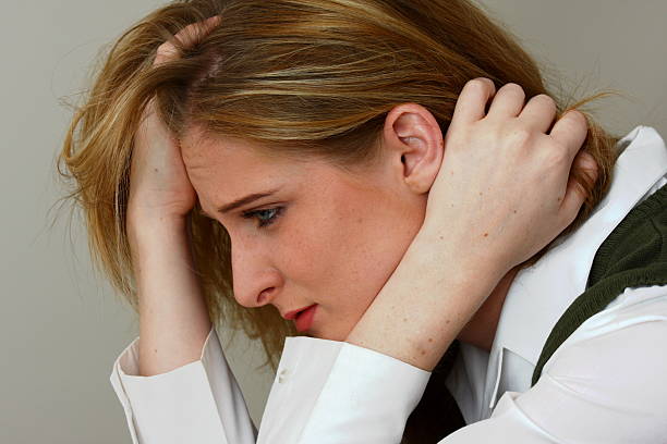 Stressed blond business woman stock photo