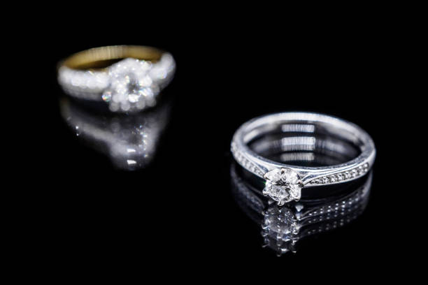 istock Close up Jewelry diamond ring on black background with reflection 932542486