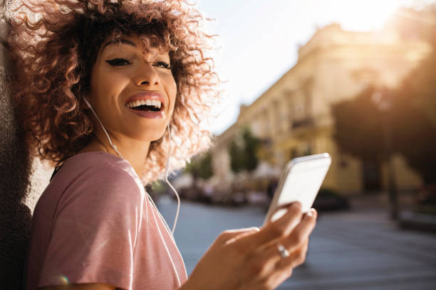 istock Smiling while listening to music 932546202