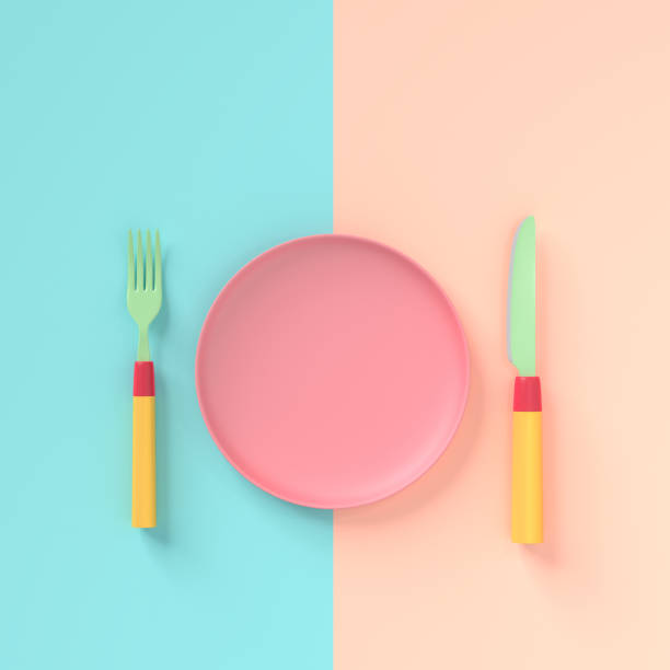 Fork with knife and  plate pastel color with copy space for your text